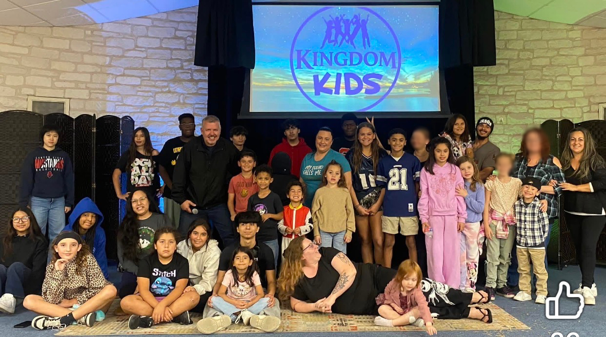 Children, teens, and adults gathered for a KINGDOM Kids Ministries group photo